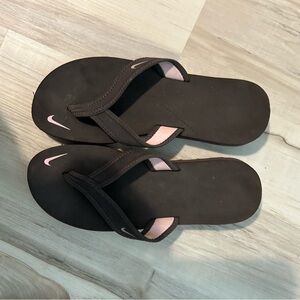 Nike , brown flip flops . Size 7